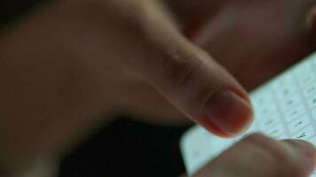 Female hands typing text on smartphone close-up video