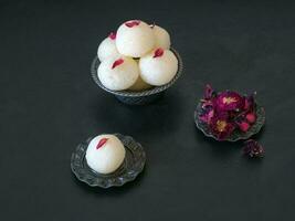 Close up Indian Rasgulla dessert. Sweet served in a bowl, top vi photo