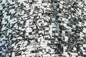 Mosaic of mirror pieces with reflection. Abstract mirror background made up of mirror fragments photo