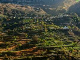 Village in the gorge of the Caucasus mountains. High-mountain village in Dagestan. photo