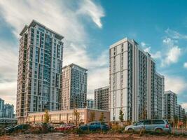 Modern residential neighborhood in the Moscow. Skyscrapers on the background of the evening blue sky photo