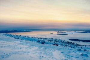 Beautiful Arctic sunset. Scenic colorful sky at dawn. Aerial view of sunrise bright sky. Top View from high altitude. photo