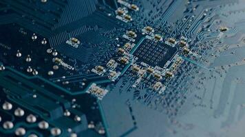 Computer electronic circuit board with radial conductor tracks and SMD capacitors rotating macro video