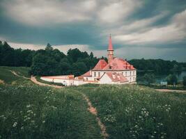 Summer lcloudy andscape with a Priory Palace in Gatchina. Russia photo