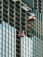 Elevators lifts to the construction sites of a skyscraper under construction. photo