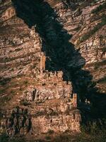 The ghost village of Old Kahib, Russia, Republic of Dagestan. Vertical view. photo