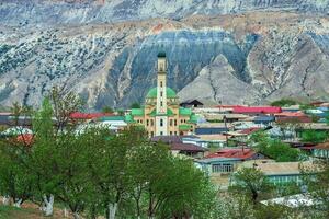 Mosque in spring in an authentic mountain village. Mosque in the center of a mountain village. Landscape and countryside of cityscape in Salta. Dagestan. photo