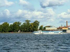 Saint-Petersburg. Speed boat taxi sailing on the river Neva photo