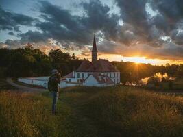 Wonderful evening sunny landscape. Incredible majestic Priory Palace in Gatchina. Popular locations for photographers, concept of travel vacation. Amazing natural background photo