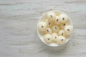 Sponge Rasgulla sweets, famous indian sweet food. photo