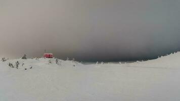 Cabin in evening winter. Dubldom on the mountain Volodyanaya Kandalaksha, Murmansk region in Russia. Panoramic view. photo