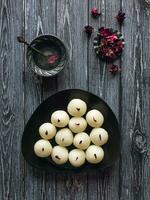 Sponge Rasgulla sweets, famous indian sweet food. Top view photo