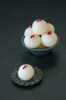 Close up Indian Rasgulla dessert. Sweet served in a bowl, top vi photo