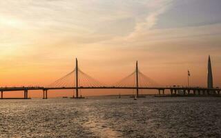 Beautiful twilight panoramic view of navigation on the Neva River in St. Petersburg. Small cable-stayed bridge. photo