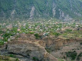 Village in the gorge of the Caucasus mountains. High-mountain village in Dagestan. photo