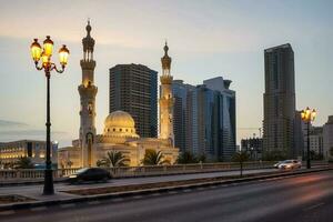 Sharjah Emirate embankment with mosque in the evening photo