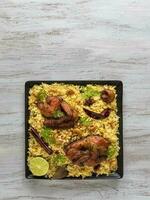 Kabsa tandoor dish. Mandi is a rice dish with meat and th photo
