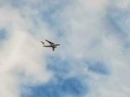 A heavy transport plane is flying in the sky photo