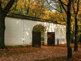 The gate in the stone wall of the tsar's court near the protected oak grove in Kolomenskoye. photo