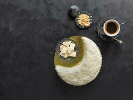 Festive food Ramadan background. Delicious homemade cake in the shape of a Crescent moon, served with dates and coffee cup photo