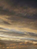 Amazing gradient of the evening sky. Colorful cloudy sky at sunset. Sky texture, abstract nature background, soft focus photo