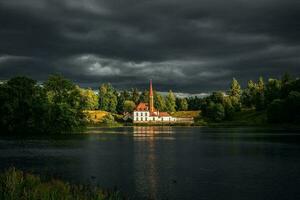Beautiful summer cloudy landscape with a Priory Palace in Gatchina. Russia photo