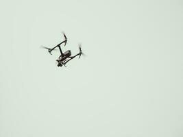 Flying handmade drone on sky background photo