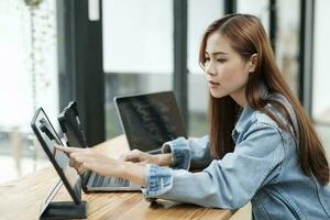 Young programmer or IT specialist satisfied with her work done. photo