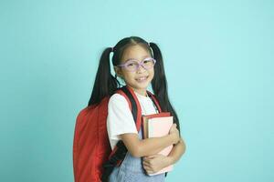 Close-up kid schoolgirl wearing glasses, she nice cute attractive cheerful amazed. photo