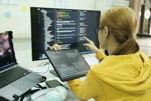 Programmer is coding and programming software. photo