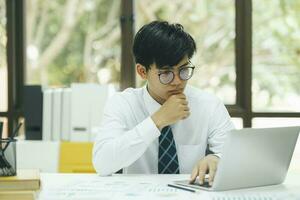 Asian businessman analyse investment marketing data. photo