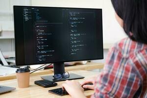 Programmers and developer teams are coding and developing software photo