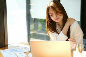 Young office woman Shoulder pain concept Office Syndrome. photo