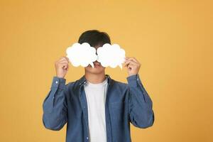 Asian man holding speech bubble. photo