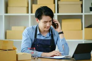 Asian business owner always keep contact with customer. photo