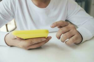 Close up of man using mobile phone. photo