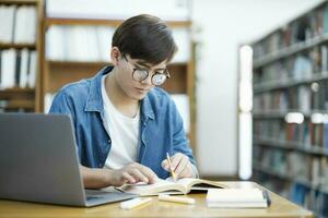 Student studying at library. photo