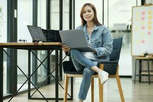 Young programmer or IT specialist satisfied with her work done. photo