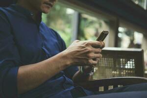 Close up of man using mobile phone. photo