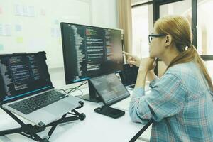 Programmer is coding and programming software. photo