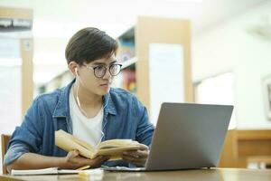 Student studying at library. photo