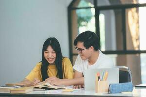 Young students campus helps friend catching up and learning. photo