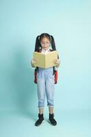 Close-up kid students girl smiling holding book, going to school. photo