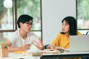 An asian students are reading books and study, Tutoring together. photo