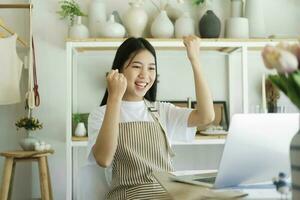 Enjoy young woman celebrate success or happy pose. photo