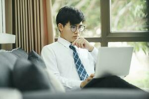 Businessman working at office using laptop. photo