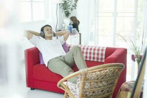 Young Man In Headphones Listening Music photo