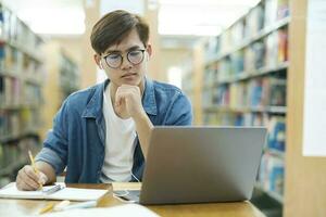 Student studying at library. photo