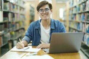 Student studying at library. photo