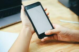 Close up of man hand holding smart phone. photo